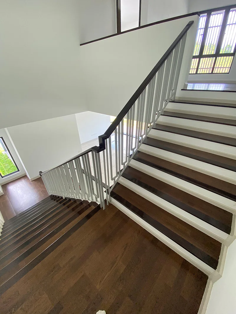 Trilia, Bukit Jelutong — three-strip engineered white oak · walnut stain, original project photograph 1